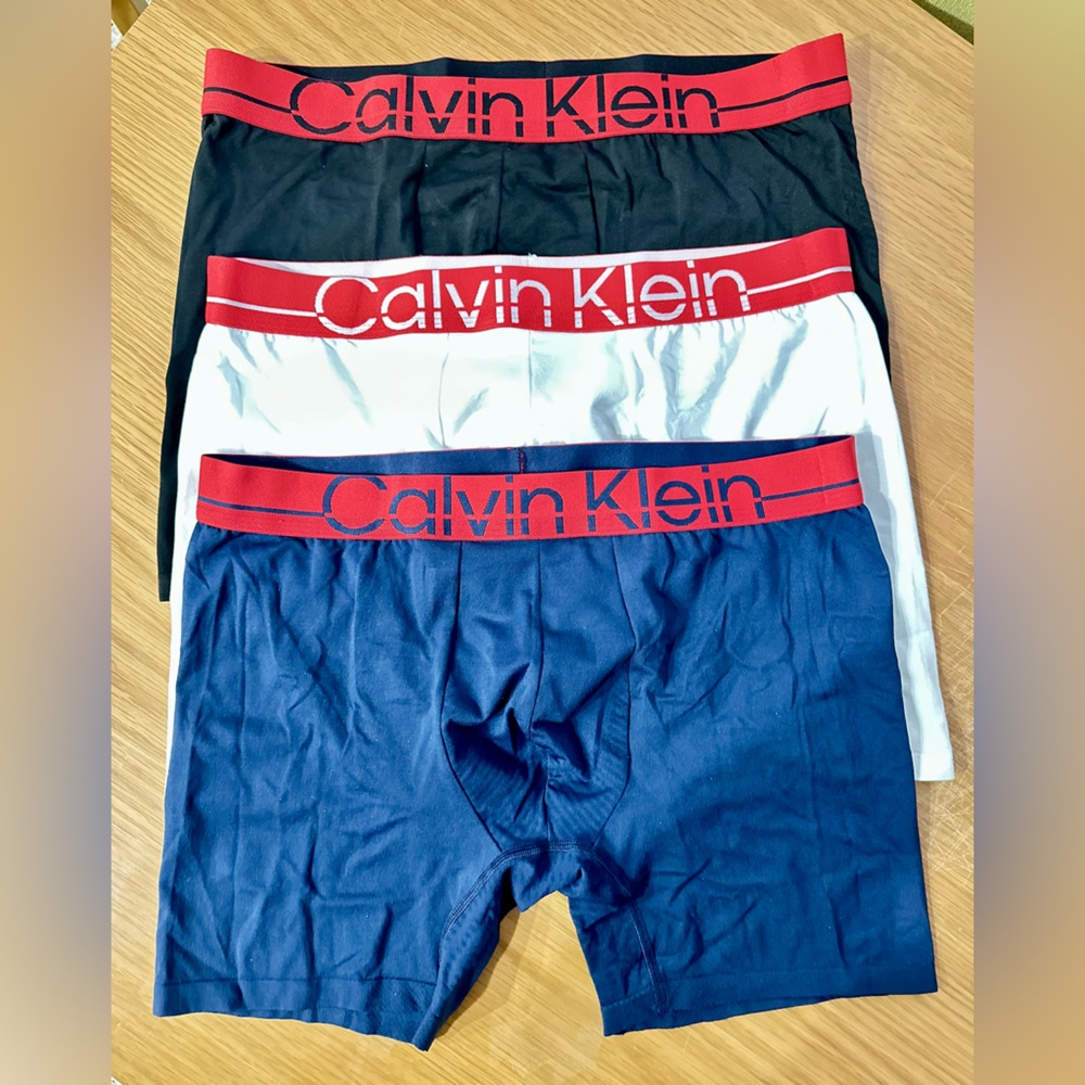 Three (3) Calvin Klein Navy Boxer Briefs with Red Waistband